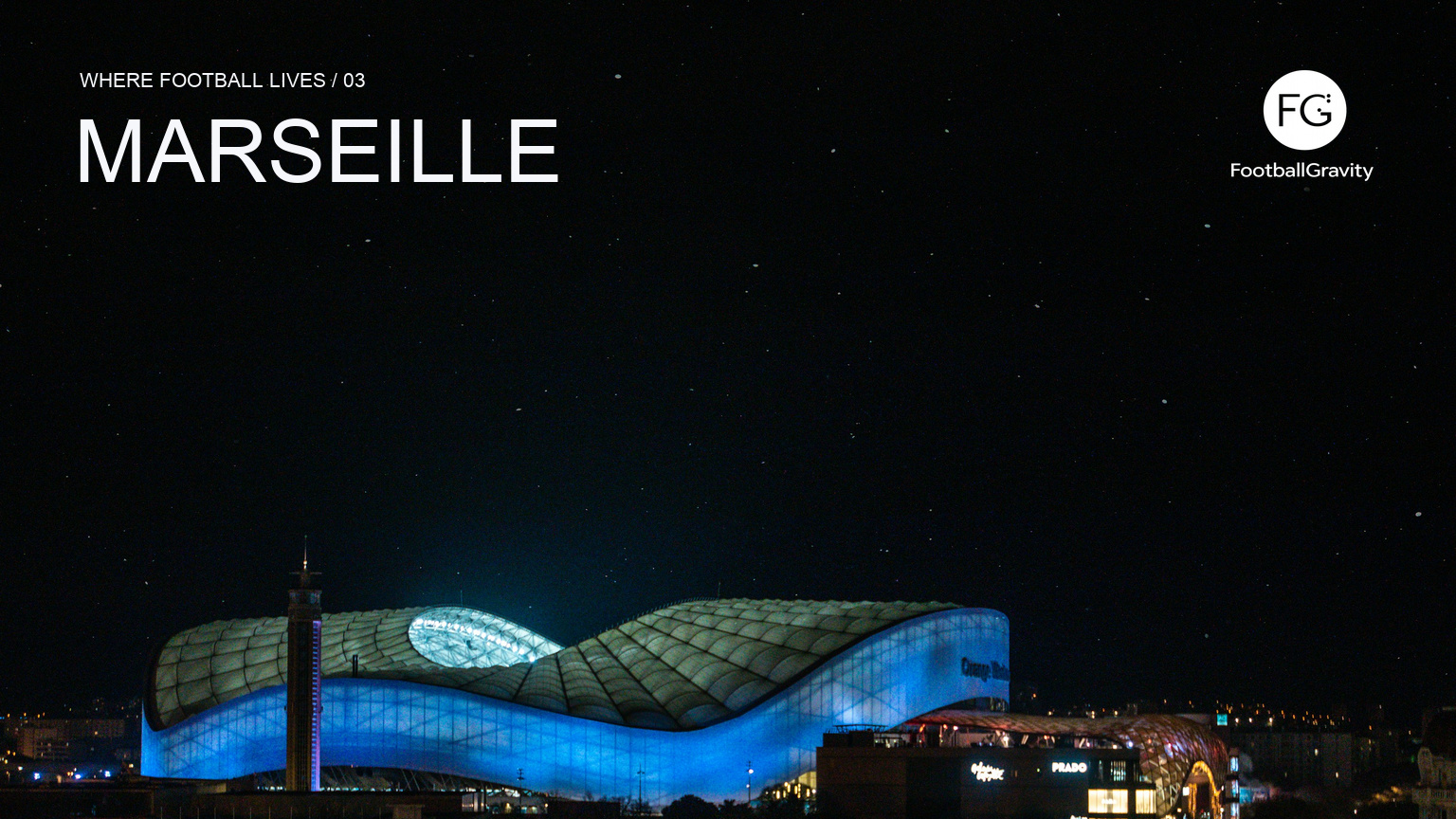 The illuminated roof of Stade Vélodrome above Marseille at night, with Marseille series typography and the FootballGravity logo.